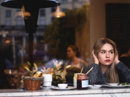 Single Woman sitting alone in cafe