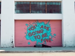 graffiti art on a building wall saying you are going to be fine