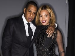 Jay Z and Beyonce dressed in all black suit and dress